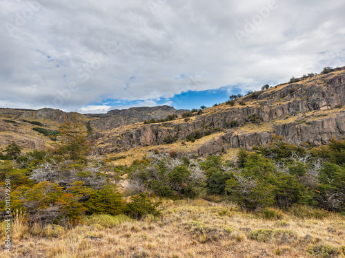 Photography Wide view of the rugged rocky mountains and shrubby vegetation in Los Glaciares