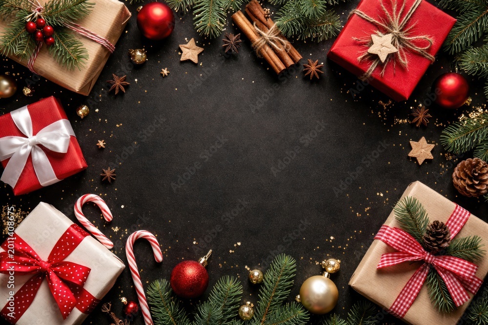 Obraz premium Top view of simple Christmas gifts and ornaments arranged on black surface with copy space