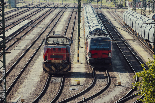 Freight locomotives on parallel railway tracks