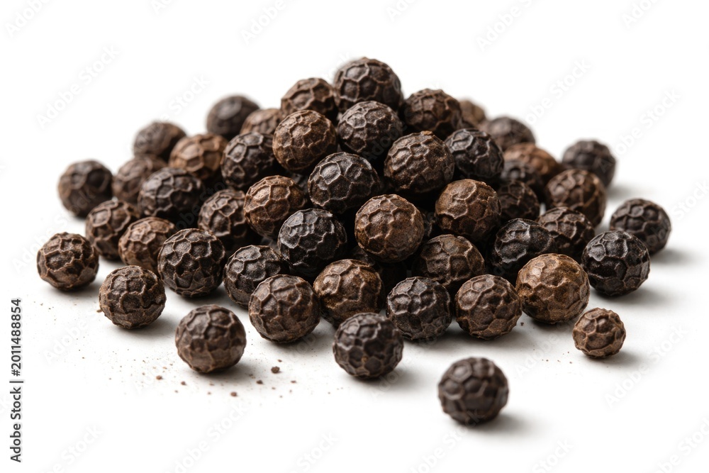 Obraz premium group of black peppercorns displayed on simple white surface