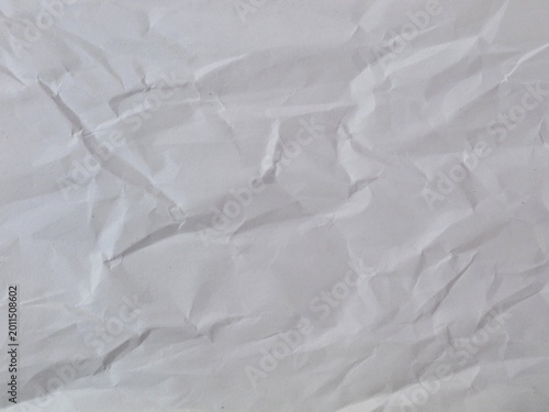 Obraz na płótnie Crumpled white paper texture background with wrinkled surface, perfect for vinta