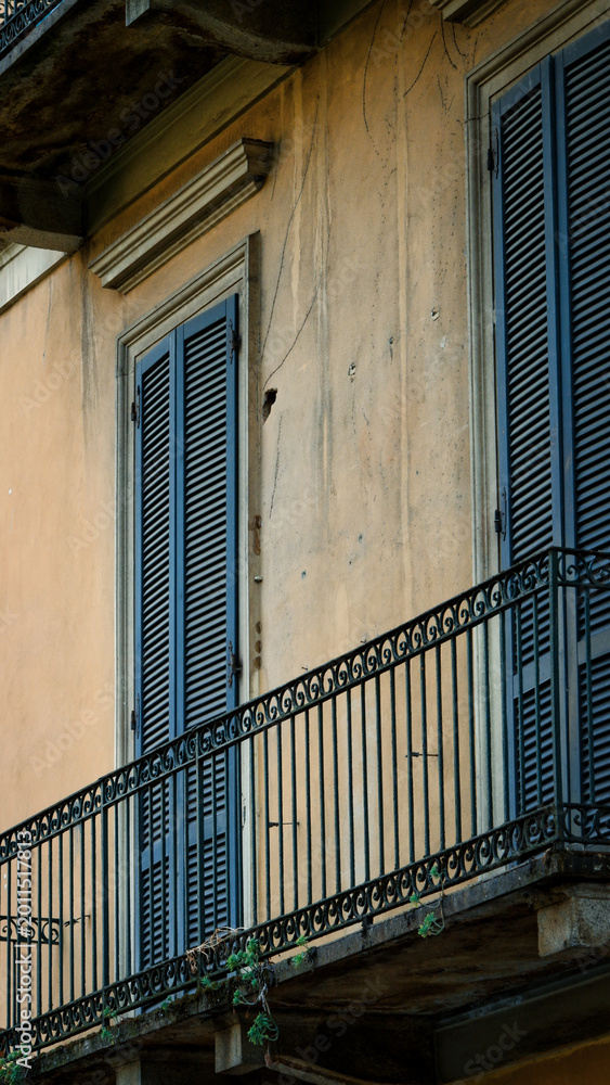 Fototapeta premium Traditional Italian Balcony with Wooden Window Shutters