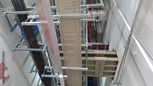 Data Center Corridor Infrastructure with Busduct, Cable Trays and Control Systems on Shared Channel Support