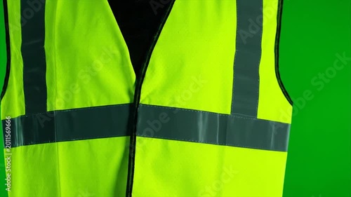 Close-up of high-visibility safety vest with reflective stripes