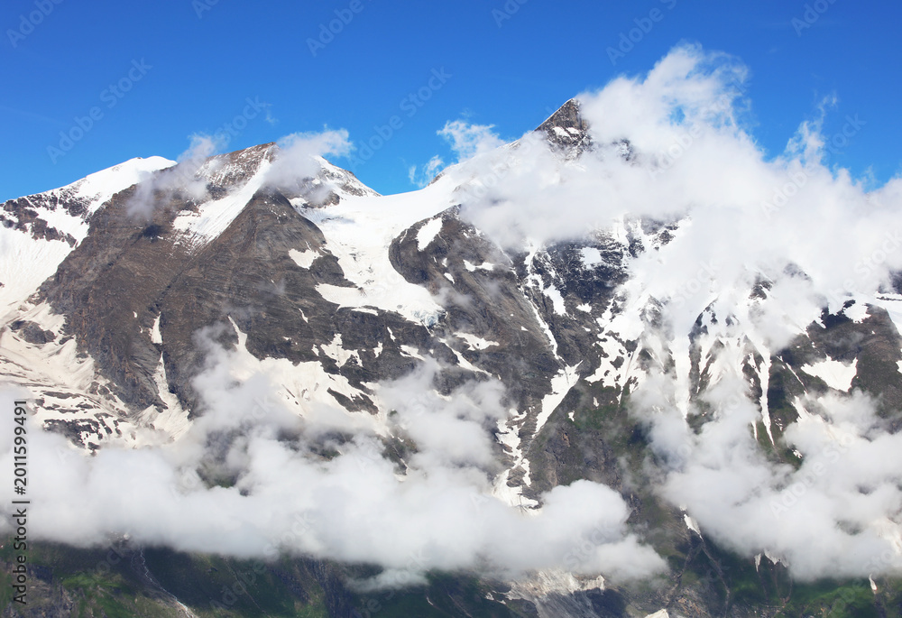Fototapeta premium Awesome alpine highlands in sunny day. Scenic image of fairy tale Landscape with Majestic Rock Mountain on background. Austria Alps