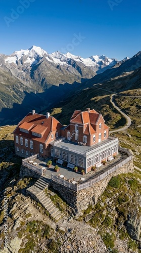 Mountain hotel with snowy peaks in background