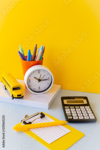 Study reset routine with clock calculator and school bus toy, time blocking academic productivity setup, dopamine desk stationery in bright yellow and blue, school admin core workspace still life