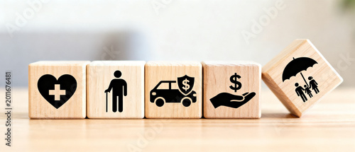 A clean and minimalist arrangement of five wooden blocks, each featuring an icon symbolizing essential life protection, financial planning, and insurance concepts for a secure future