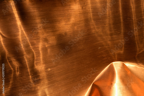 Vászonkép Bent shiny copper sheet