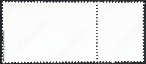 Fotografie Clean empty back of two connected postage stamps against a dark background