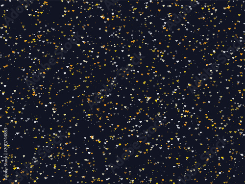 Small golden and silver hearts on a dark background pattern