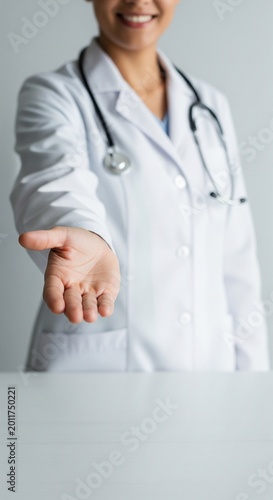 Doctor offering handshake, close-up of outstretched hand, medical professional greeting
