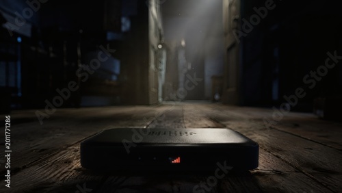 Wireless internet router glowing in a dark moody rustic room