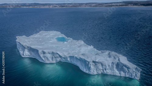 Iceberg with crystal blue water