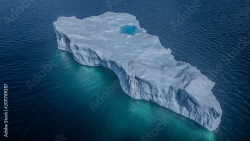 iceberg with crystal blue water