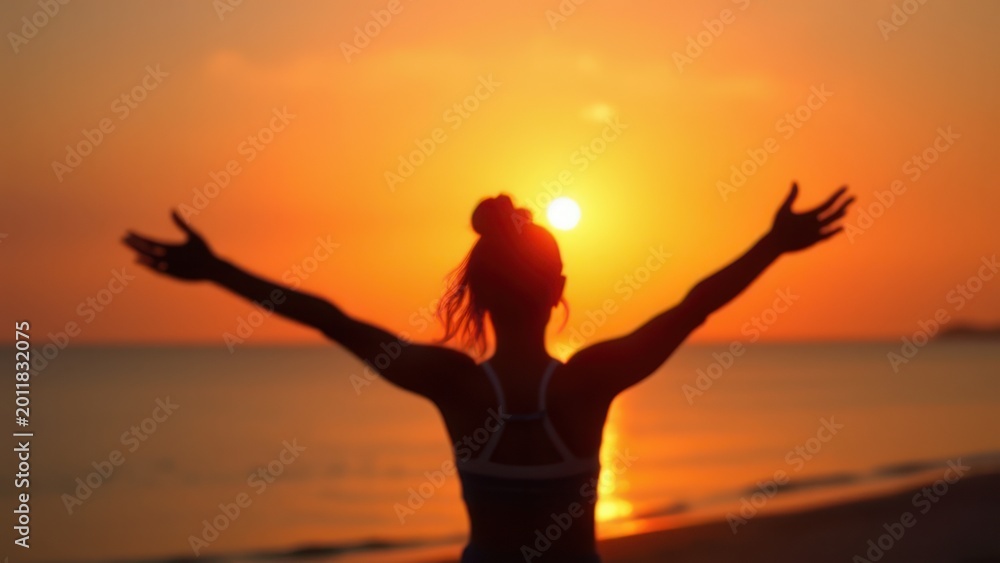 Fototapeta premium silhouette woman with arms open at sunrise krabi thailand wellness freedom concept