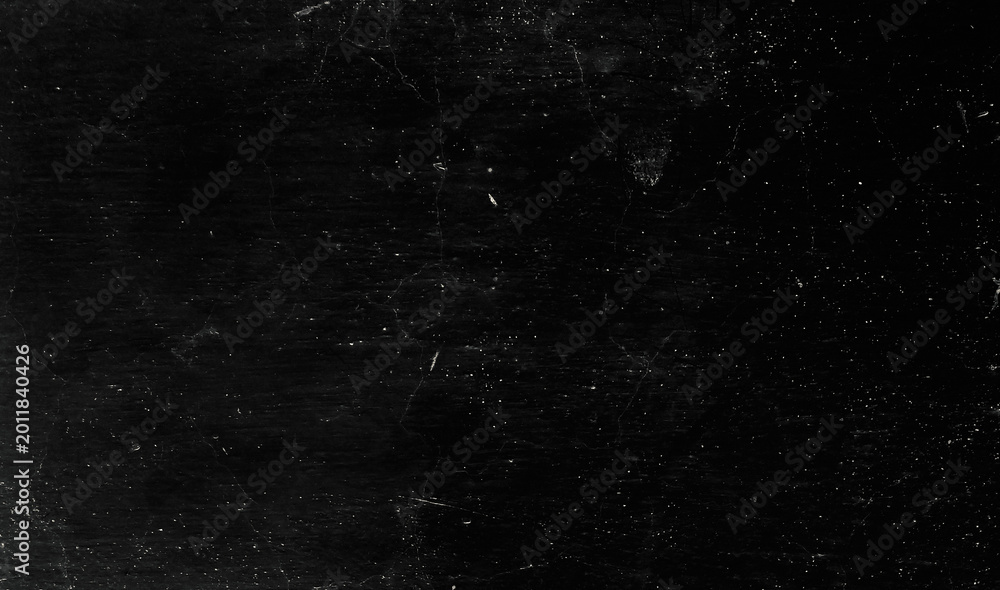 Obraz premium Vintage distressed texture on dark surface.dirty black texture background with dust overlay.Distressed wall texture for creative design.
