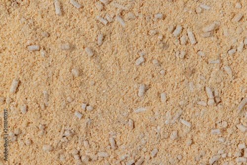 Foto wood pellets from pine sawdust after getting on them with water, the wood pallets got wet and crumbled into sawdust, some of them did not get wet and retained their cylindrical shape