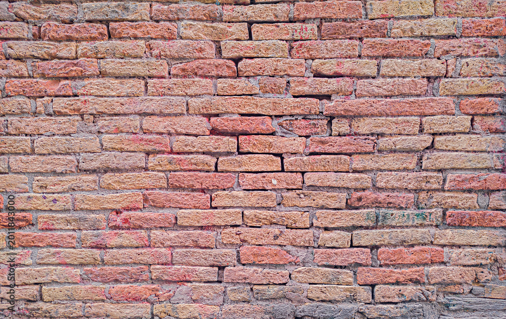 Fototapeta premium Red brick wall texture background with rustic aged masonry detail