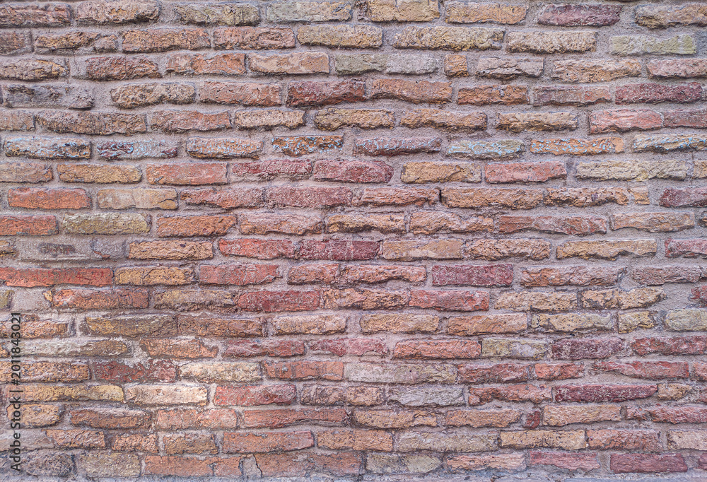 Fototapeta premium Red brick wall texture background with rustic aged masonry detail