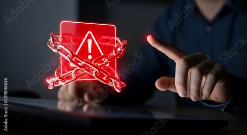 Hand pointing at glowing red warning sign wrapped in heavy metal chains