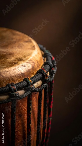 African djembe drum showing textured hide surface and ropes