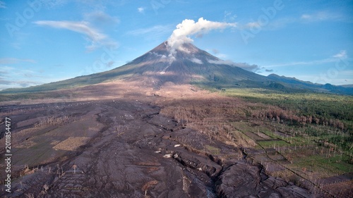 Valokuva Majestic aerial view of Semeru active volcano with crater smoke and vast volcanic lahar flow on the slope