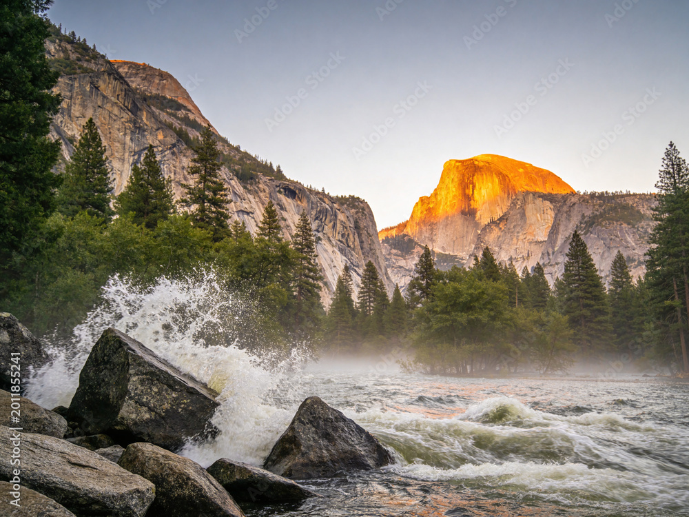 Obraz premium Majestic Granite Peaks and Rushing River Surge