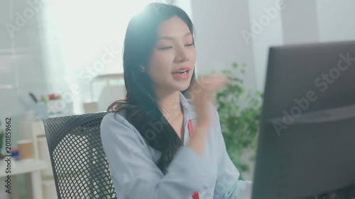 Young happy business woman having remote online work meeting or job interview. Young female employee looking at screen computer during virtual video conference call in office. brainstorming seminar.