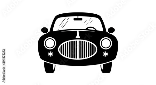 Black and white of a vintage car with headlights and grille