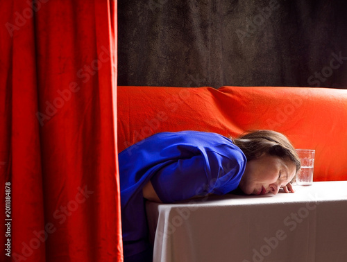 Scene of a woman in an interior behind a velvet curtain II
