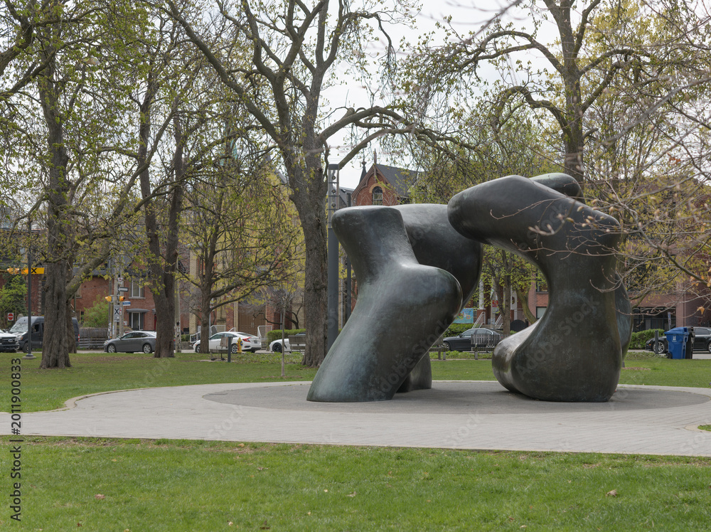 Naklejka premium view of Henry Moore's Large Two Forms in the collection of the Art Gallery of Ontario, located inside Grange Park, Toronto