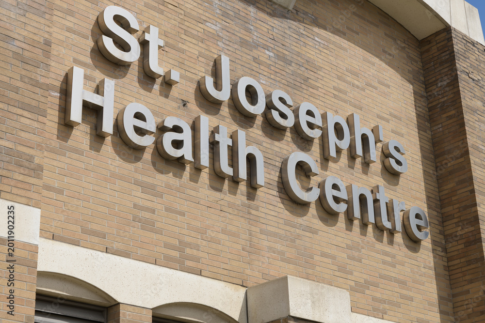 Fototapeta premium sign outside St. Joseph's Health Centre, a general hospital, located at 30 The Queensway in Toronto