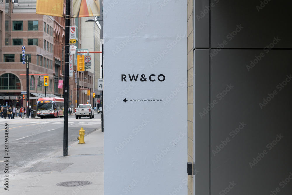 Fototapeta premium RW&CO sign with defocused view south on Yonge St outside CF Toronto Eaton Centre, 220 Yonge St, Toronto