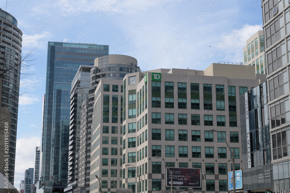 Naklejka premium looking west on Front St W to office complex incl sign at TD Insurance, 320 Front St W, Toronto