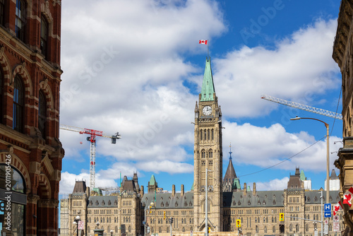 Canadian Parliament building with construction cranes in Ottawa downtown
