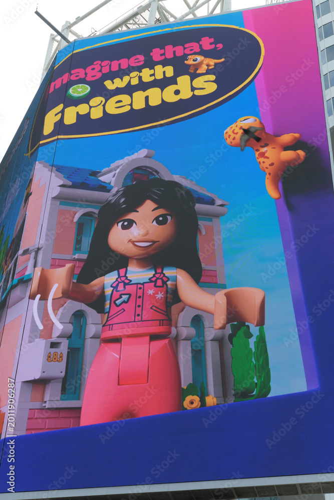 Naklejka premium digital billboard featuring toy ad (imagine that with Friends), Sankofa Square, Toronto
