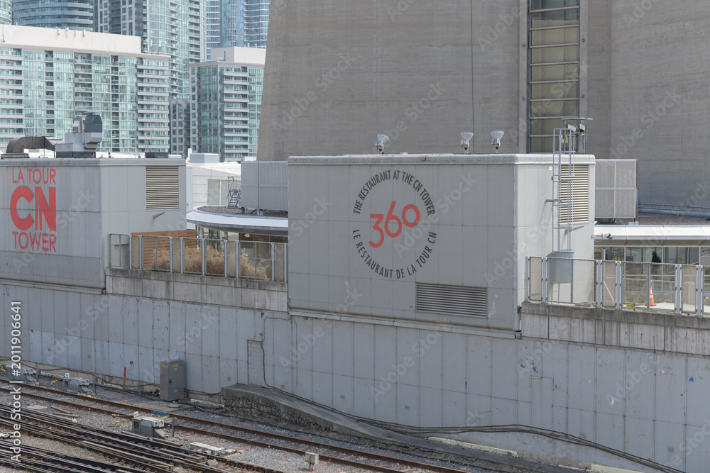 Fototapeta premium CN Tower signs (360 The Restaurant at the CN Tower) facing Union Station Rail Corridor, Toronto