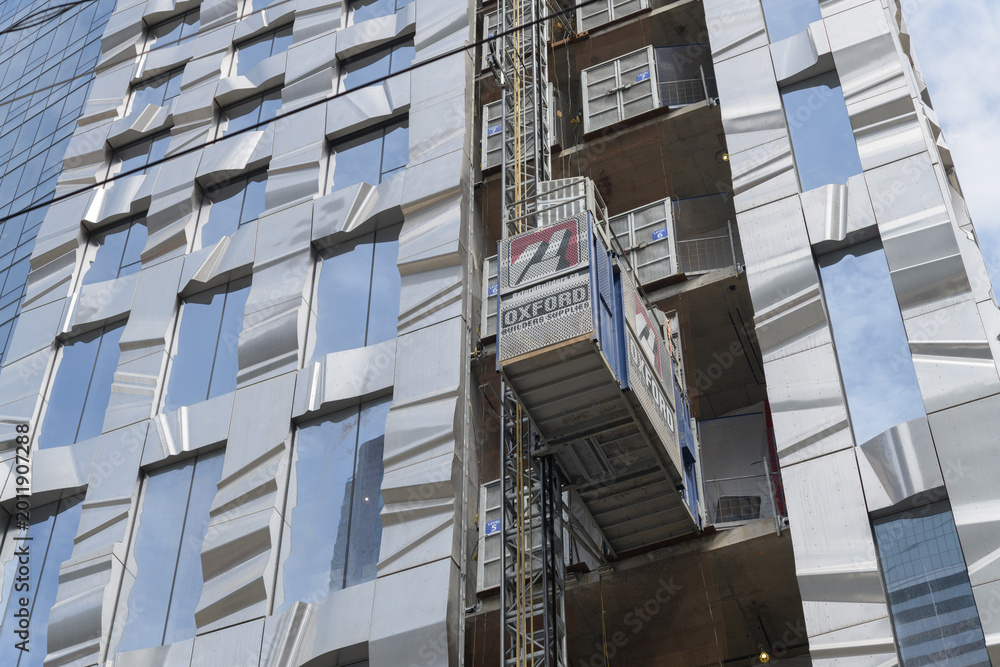 Fototapeta premium designed by Frank Gehry, FORMA condos (east tower) at Duncan (Ed Mirvish Way) and King St W, features shimmering metal ribbons and glass, Toronto