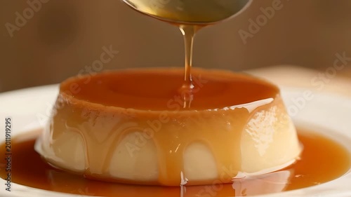 Pouring Golden Caramel Sauce over Fresh Flan Pudding Dessert in Macro Shot