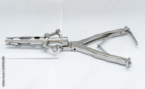 Photos Mechanical orthopedic bone spreader retractor on white surface