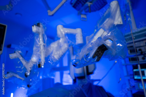 Tableau sur toile Robotic surgical arms in sterile protective covers in clinic