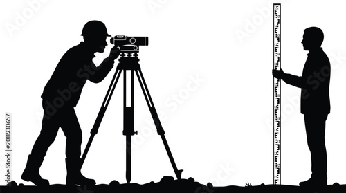 Surveyors using optical level and measuring rod on construction site