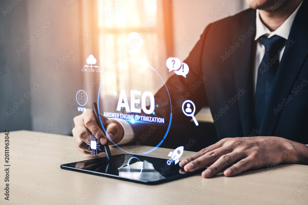Fototapeta premium Professional Businessman Using Tablet for Answer Engine Optimization Strategies in Modern Digital Workspace Fluxor.