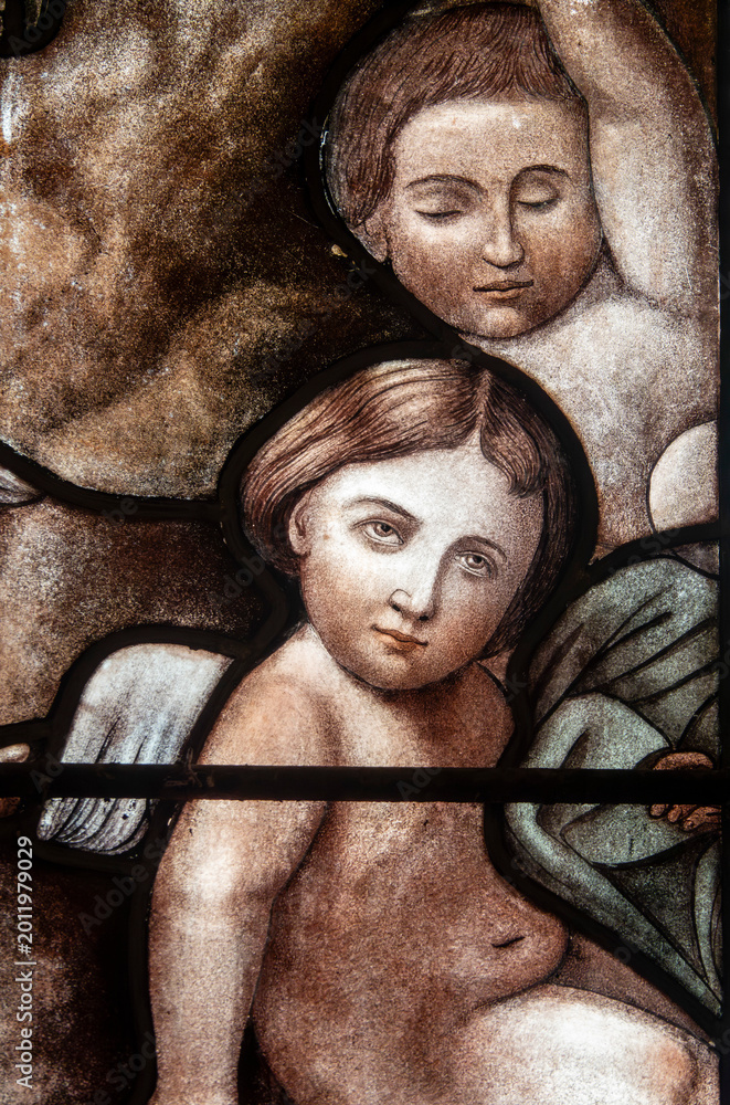 Naklejka premium Stained glass (19th century) of portraits of angels in heaven.