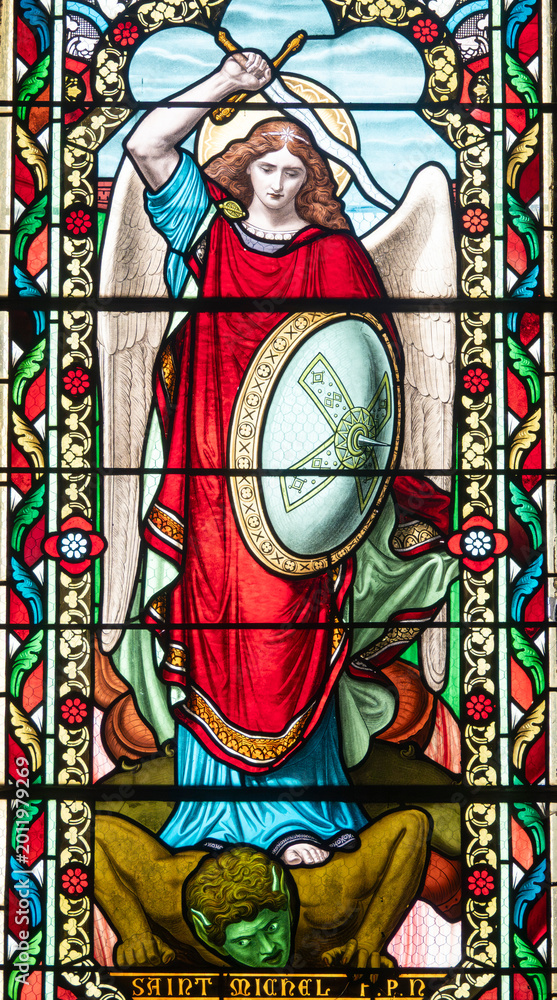 Fototapeta premium Stained glass (19th century) of Saint Michel the Archangel killing a demon.