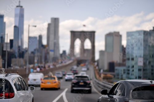 Brooklyn Bridge And Vehicle Scene. Urban Traffic With Skyline And Bridge In Focus new york