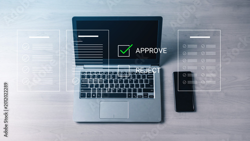 Tableau sur toile A sleek laptop on a tidy desk with visual approval and rejection options, ideal for illustrating business decision-making processes in a modern workplace setting