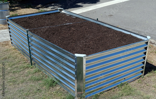 modern raised garden bed constructed from corrugated galvanized steel