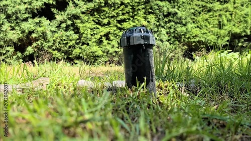 Water is wasted from the automatic sprinkler because it is not properly closed.